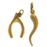 Two 9ct gold charms including horn of plenty, the largest 2.3cm high, 1.0g