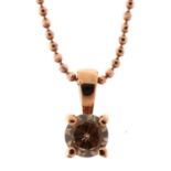 18ct rose gold cognac round brilliant cut diamond solitaire pendant on a silver gilt necklace, the