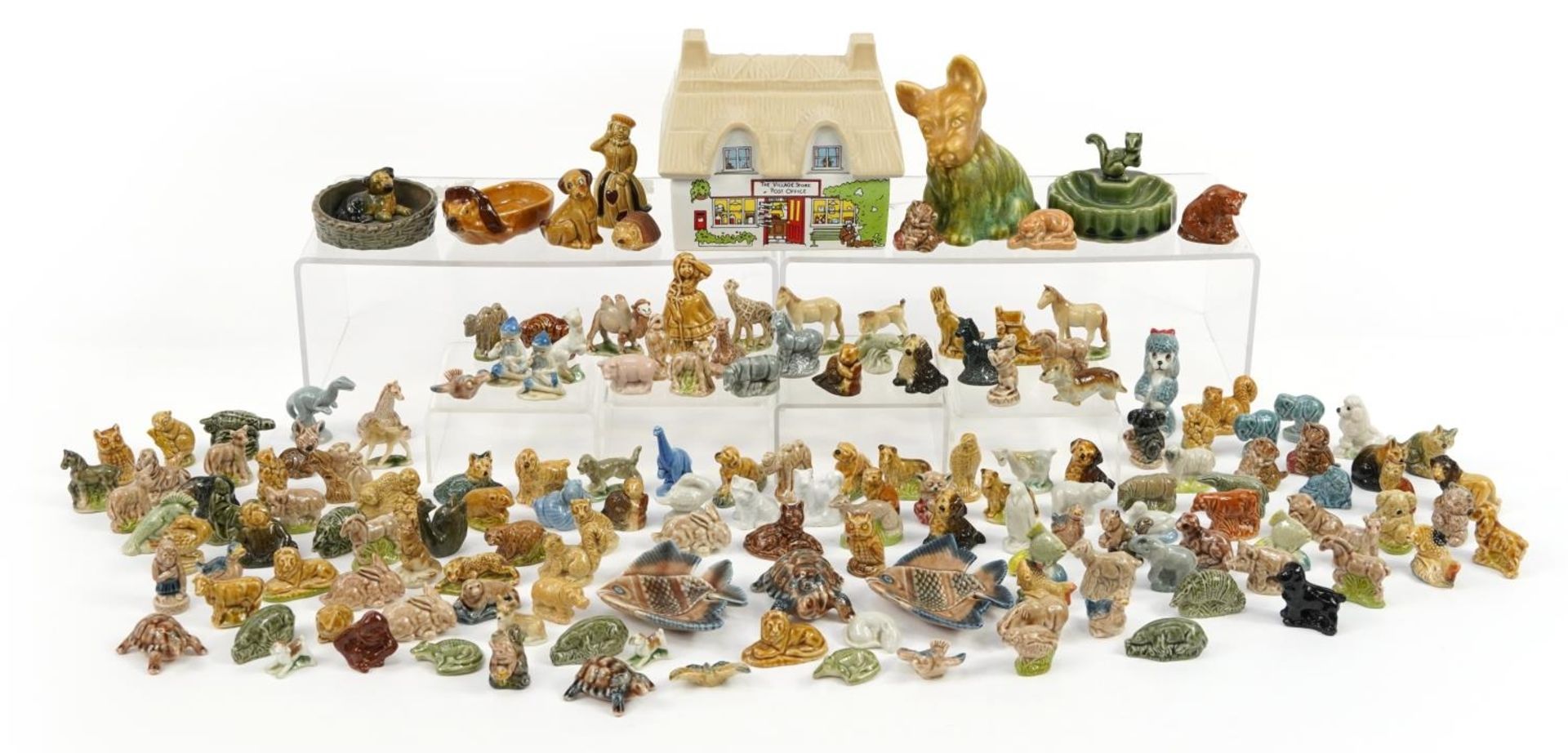 Large collection of Wade Whimseys, figures and Post Office butter dish, the largest 15cm wide