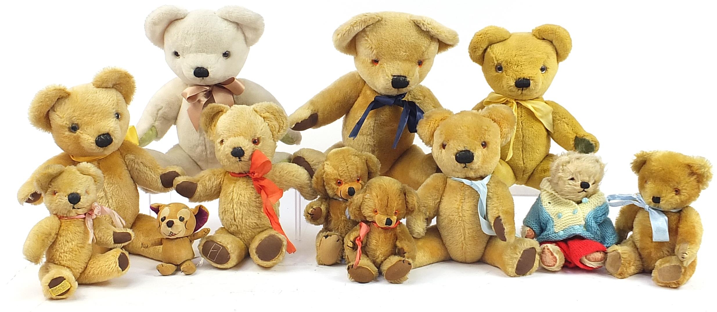 Twelve vintage and later teddy bears including Merrythought, the largest 48cm high