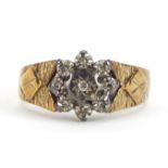 9ct gold diamond flower head ring with engine turned shoulders, size L/M, 3.2g