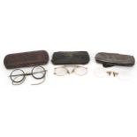 Three pairs of steel cased vintage spectacles including Dollond & Aitchison established 1750, the