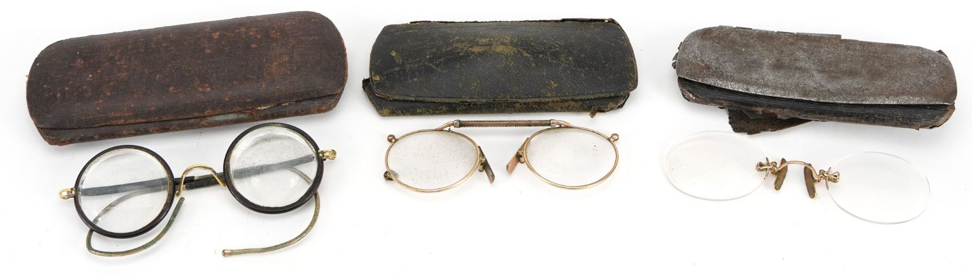 Three pairs of steel cased vintage spectacles including Dollond & Aitchison established 1750, the