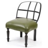 Industrial style wrought iron chair with green leather upholstered seat on turned mahogany legs,