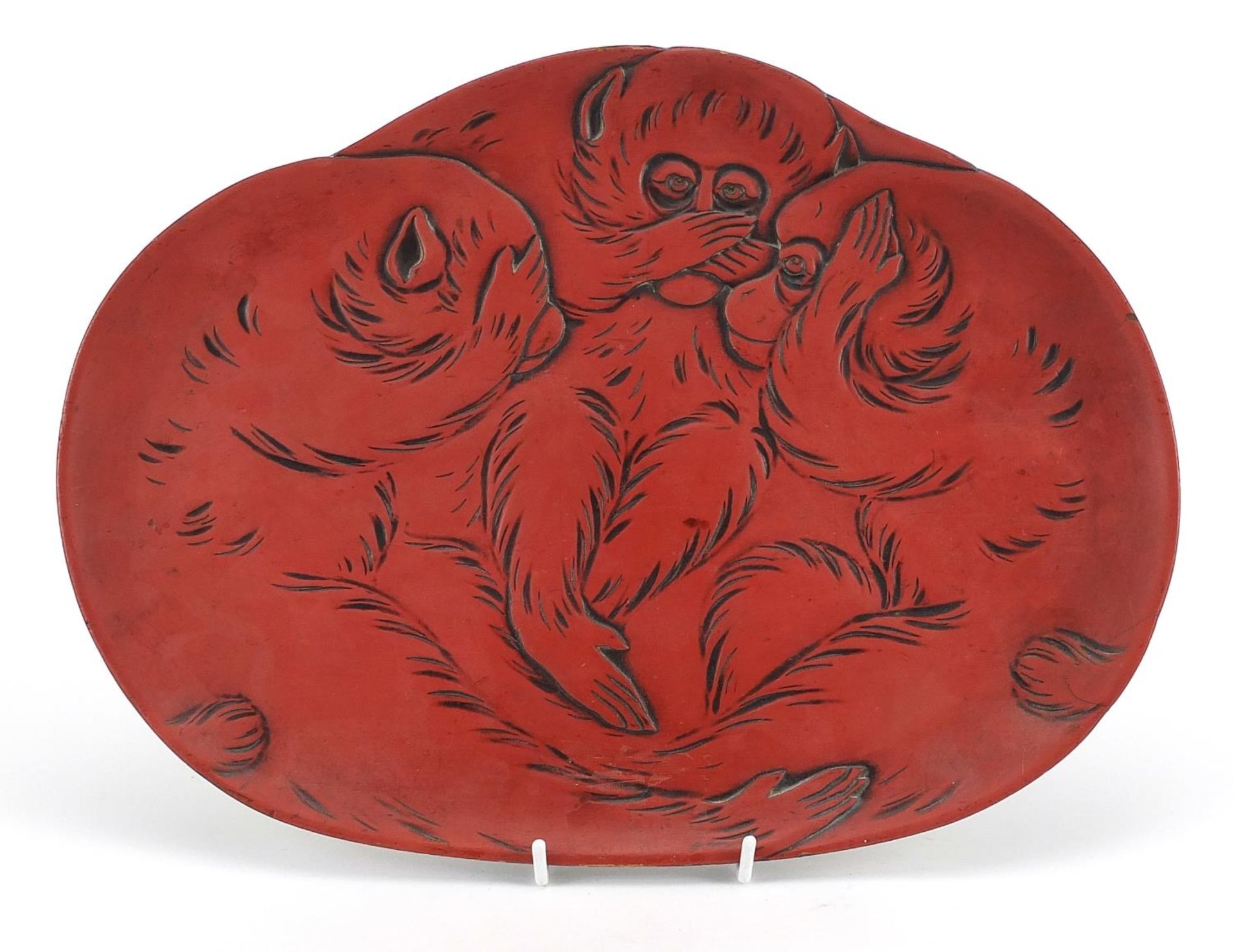 Chinese red cinnabar lacquer tray depicting three wise monkeys, 38cm wide