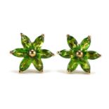 Pair of 9ct gold peridot flower head stud earrings, 1.2cm in diameter, 1.7g