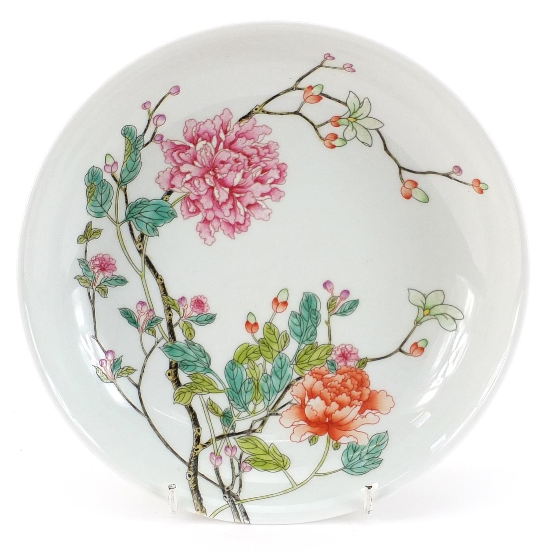 Chinese porcelain shallow dish hand painted in the famille rose palette with flowers, four figure
