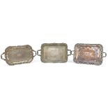 Three heavy silver plated trays with twin handles, the largest 68cm wide