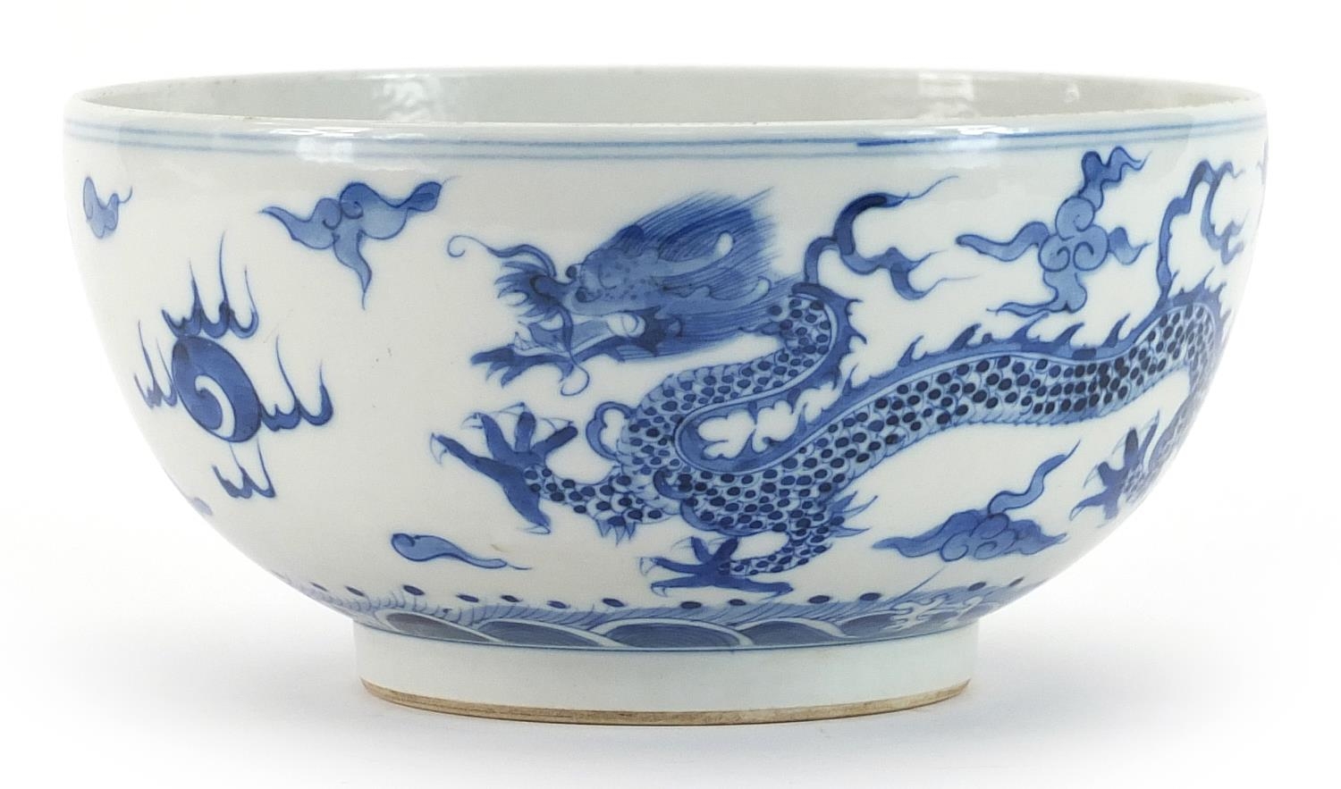 Chinese blue and white porcelain bowl hand painted with dragons chasing a flaming pearl amongst - Image 2 of 4