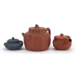 Two Chinese Yixing terracotta teapots and one other, the teapots with impressed marks, the largest