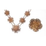 Unmarked silver filigree floral brooch and necklace, the brooch 4cm in diameter, total weight 30g