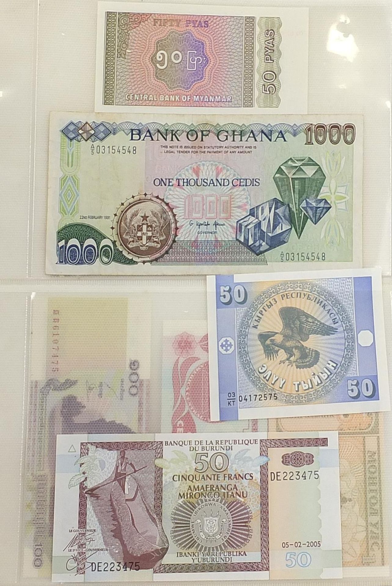 Collection of world banknotes arranged in an album including China and Brazil - Image 3 of 6