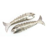 Two Peruvian style silver articulated fish with abalone eyes, each 19.5cm in length, total weight,