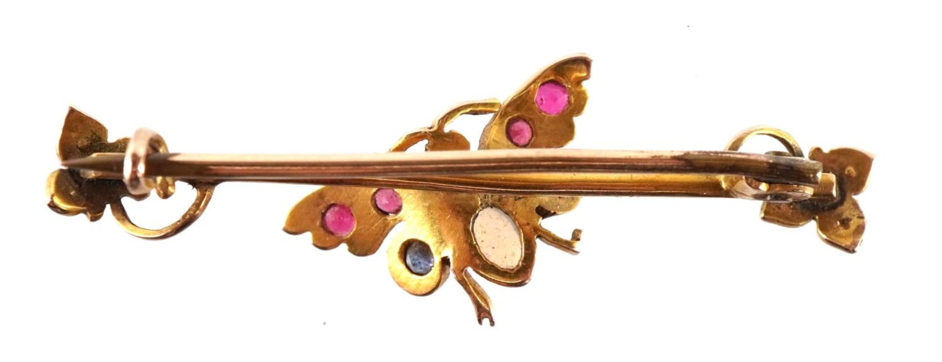 Victorian 9ct gold butterfly brooch set with seed pearls, opals and red stones housed in a tooled - Image 2 of 5