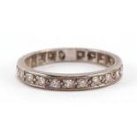 Unmarked white gold diamond eternity ring, tests as 18ct gold, housed in a Grant & Son Carlisle