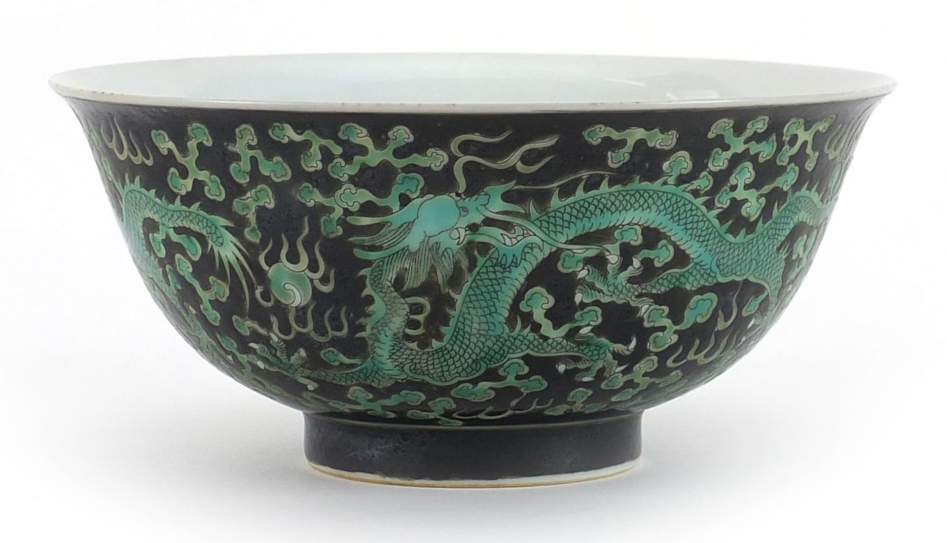 Chinese porcelain black ground bowl hand painted with dragons chasing pearl amongst clouds, 16cm