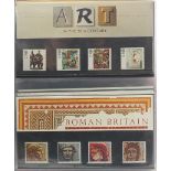 Royal Mail presentation packs arranged in an album including Royal Mail High Value Definitive stamp