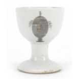 Chinese porcelain eggcup hand painted and gilded with an armorial crest, Guest & Grey label to the