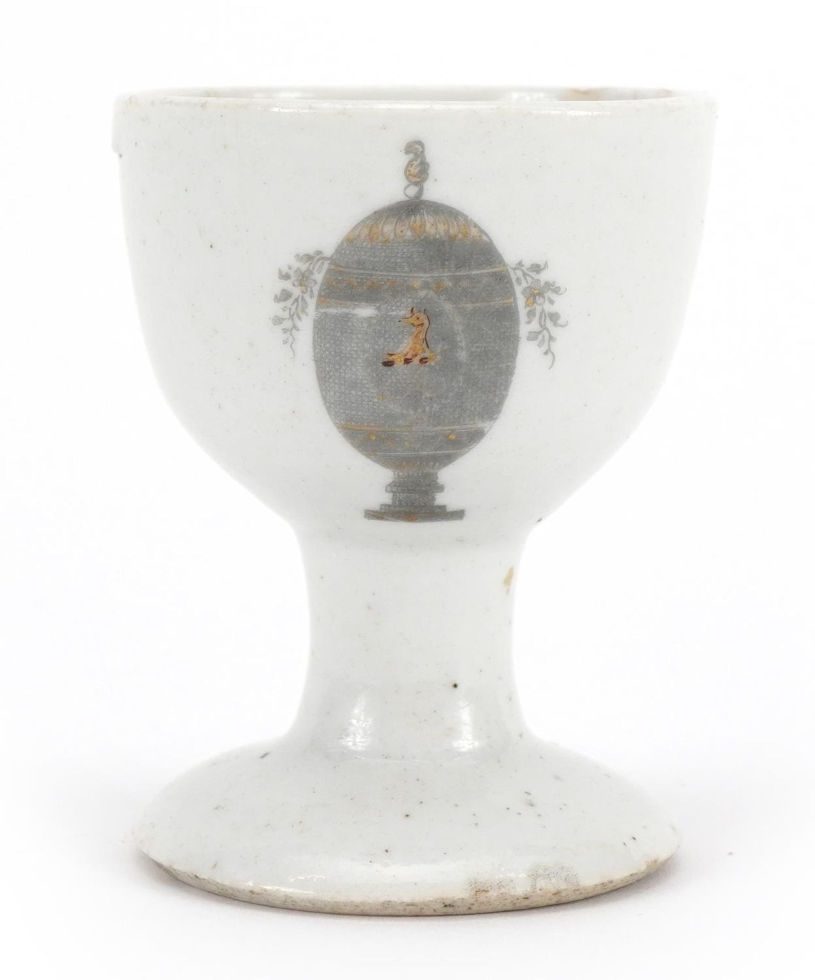Chinese porcelain eggcup hand painted and gilded with an armorial crest, Guest & Grey label to the