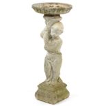 Garden stoneware bird bath in the form of a young child, 88cm high