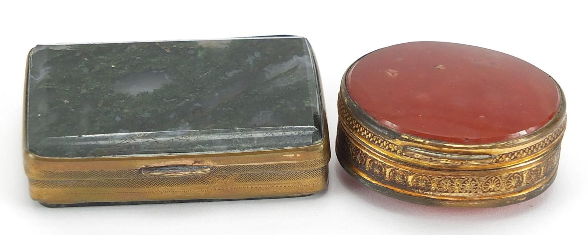 Two brass pill boxes including one with moss agate, the largest 6cm wide