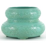 Chinese porcelain four footed double gourd vase having a turquoise glaze decorated in low relief