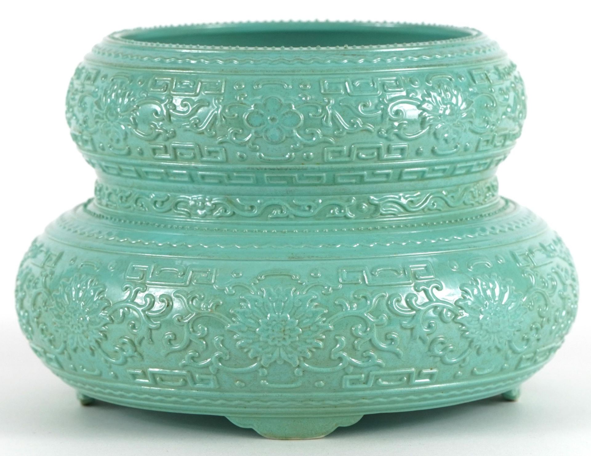 Chinese porcelain four footed double gourd vase having a turquoise glaze decorated in low relief