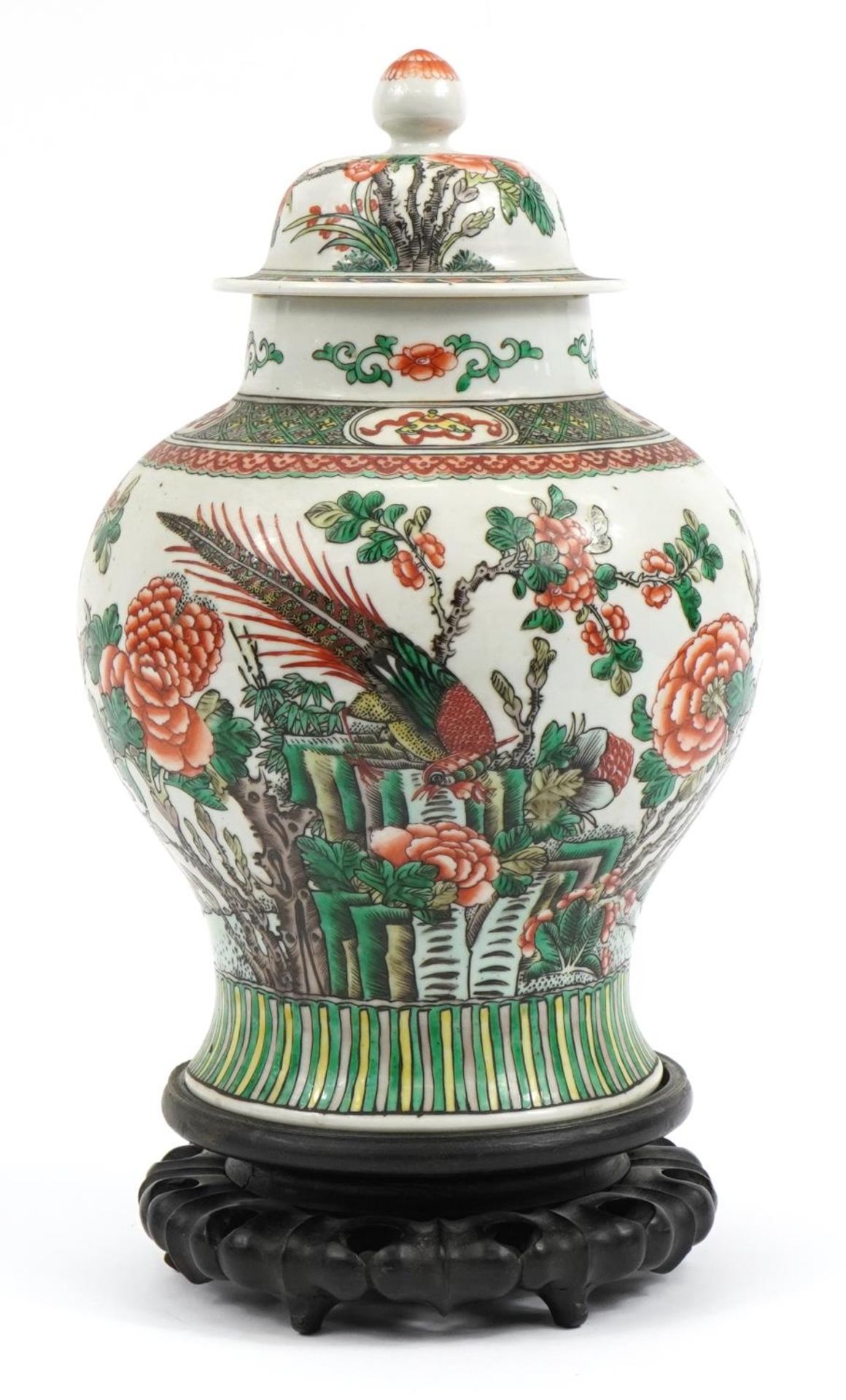 Chinese porcelain baluster vase and cover raised on carved hardwood stand, hand painted in the