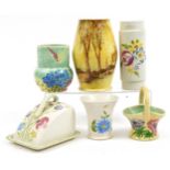 Five Bradford Pottery vases and butter dish with cover, each hand painted with flowers and trees,