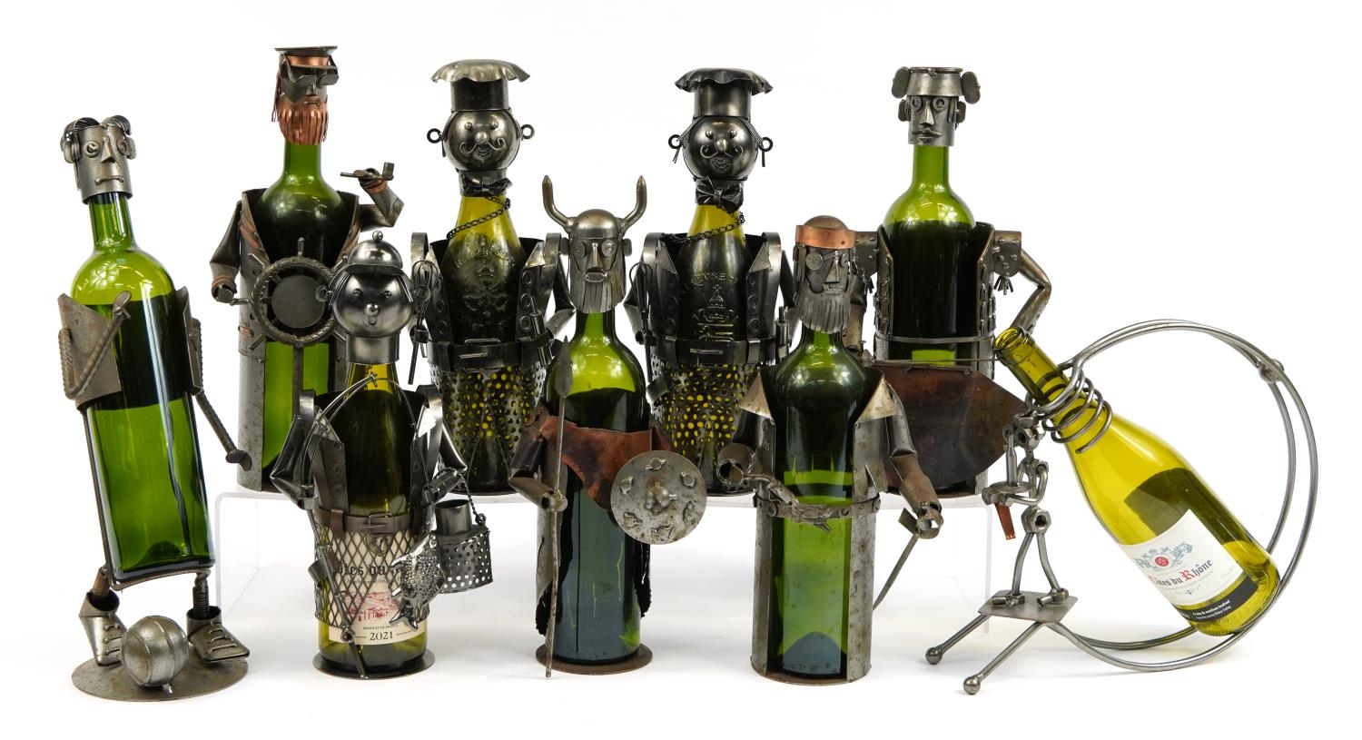 Collection of nut and bolt design bottle holders with empty bottles, the largest approximately