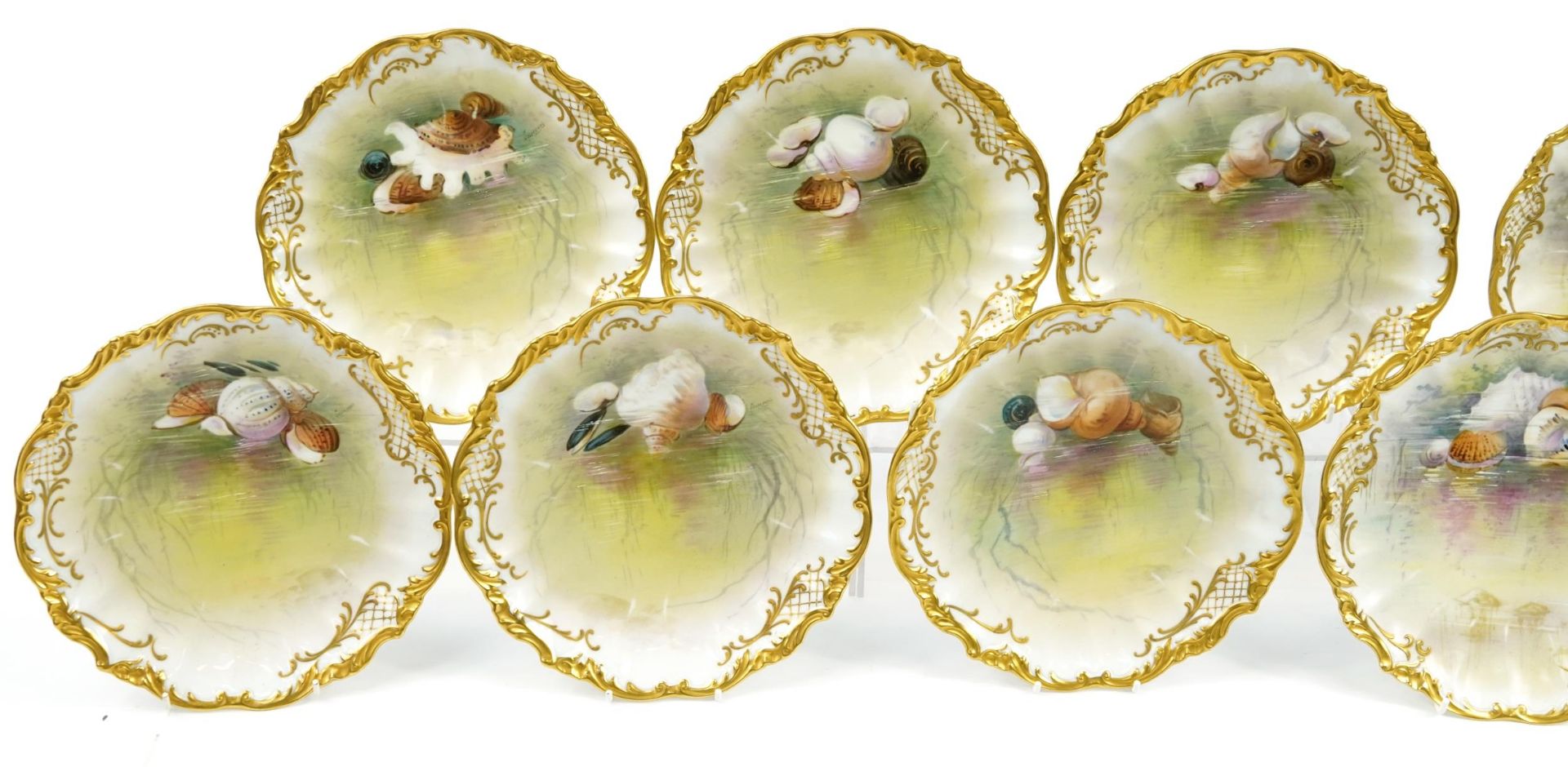 Limoges, Ten French porcelain desert plates with gilt borders, each hand painted with shells and - Image 2 of 5