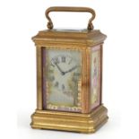Miniature brass carriage clock with Sevres type panels and Roman numerals numbered 3006 to the