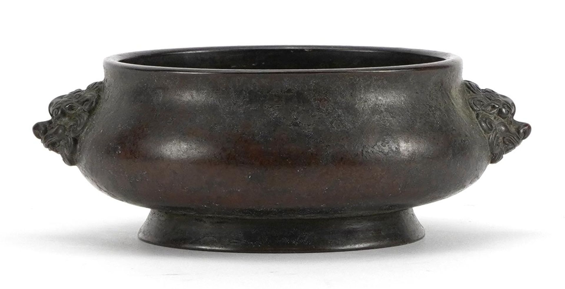 Chinese bronze incense burner with animalia twin handles, four figure character marks to the base,