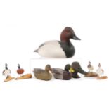 Eight hand painted wooden duck decoys and figures, some signed Parker, the largest 34cm in length