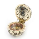 Sailor's style carved bone pocket globe compass, 4cm in diameter