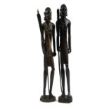 Large pair of African carved figures of tribes people holding spears, the largest 79cm high