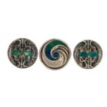 Archibald Knox for Liberty & Co, three Arts & Crafts silver and enamel buttons including a pair