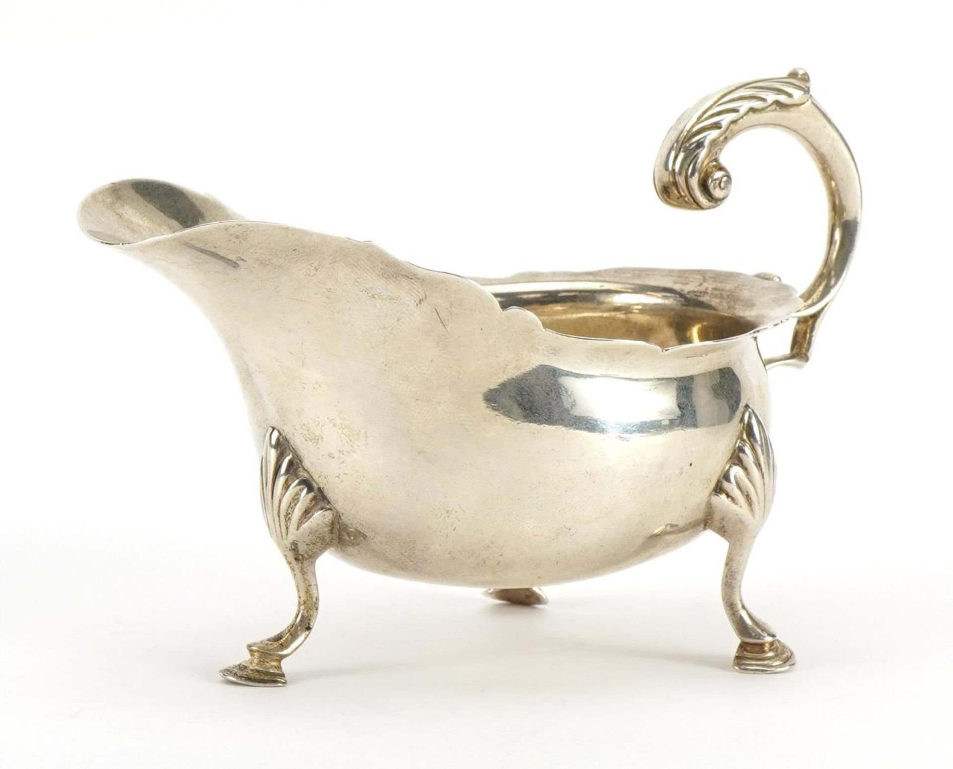 Hamilton & Inches, Scottish silver sauceboat raised on three hoof feet, Edinburgh 1905, 14cm in