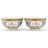 Pair of Chinese porcelain bowls hand painted in the famille rose palette with dragons chasing the