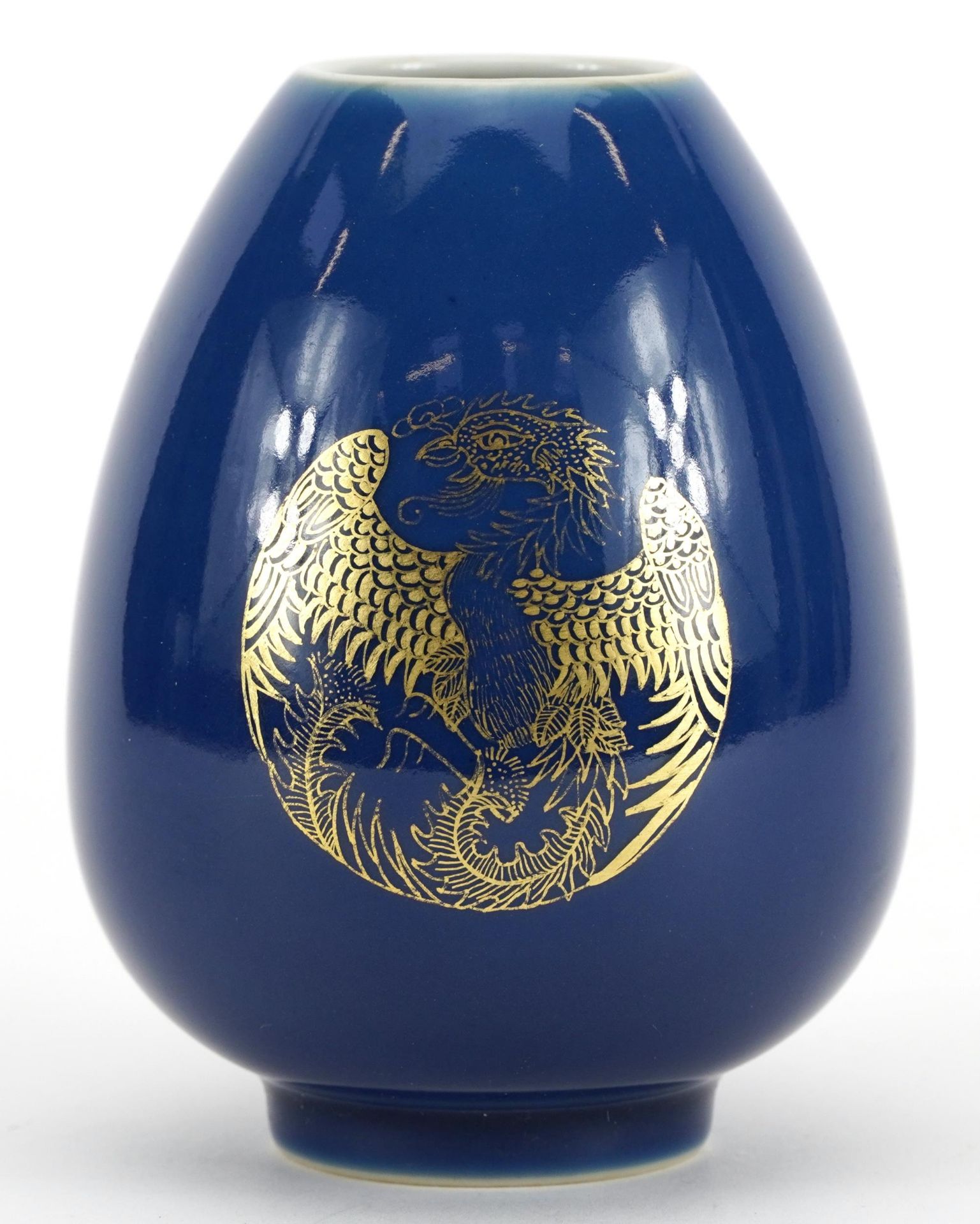Chinese porcelain vase having a powder blue glaze, gilded with three roundels of stylised phoenixes,