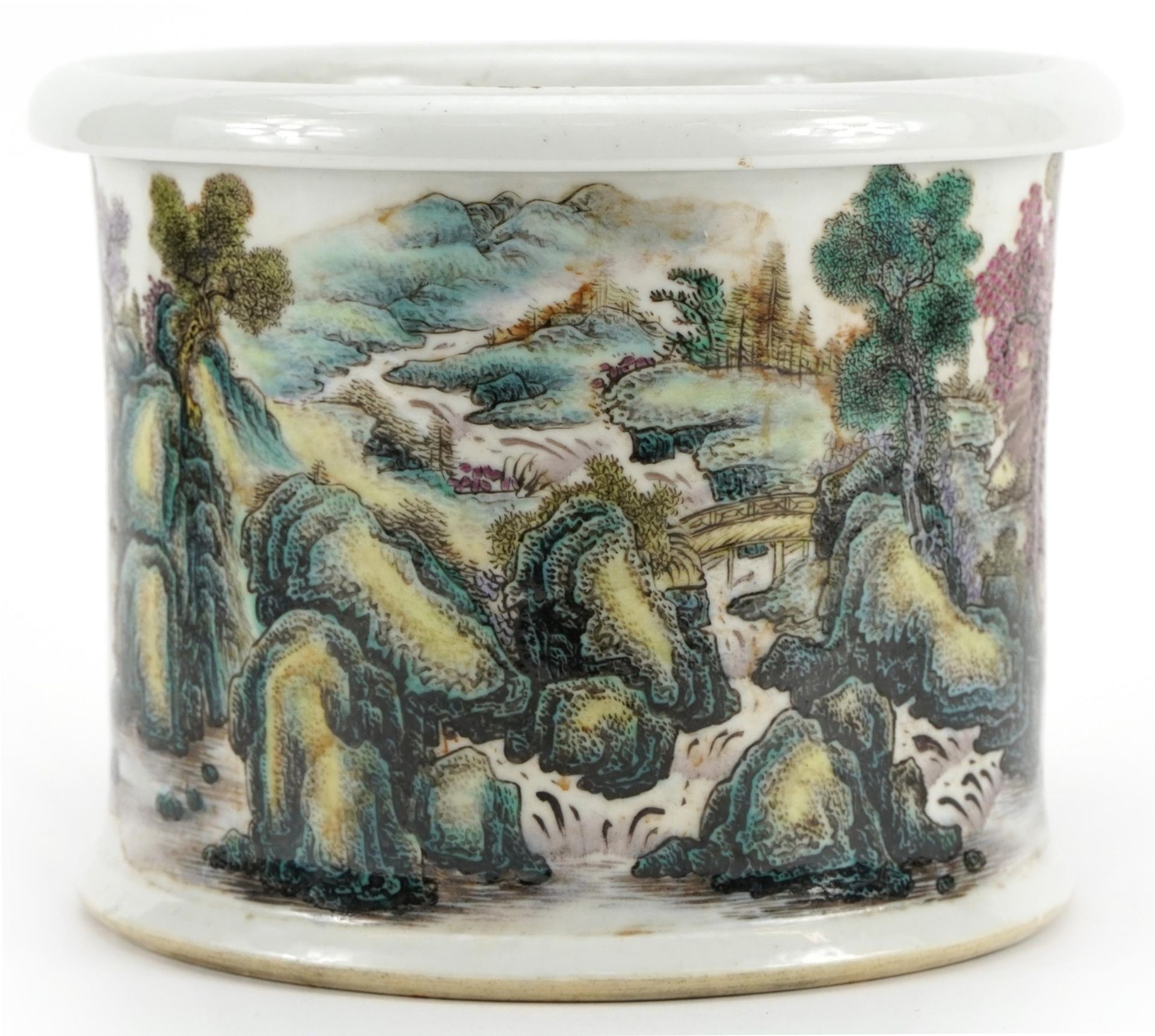 Chinese porcelain brush pot hand painted in the famille rose palette with continuous river landscape
