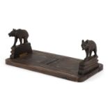 Black Forest extending book slide carved with two bears, 30.5cm wide when closed