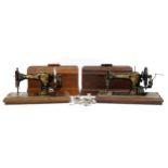Two Victorian Jones cast iron sewing machines with cases