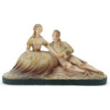 Art Deco plaster figural group of a courting couple, 45cm wide