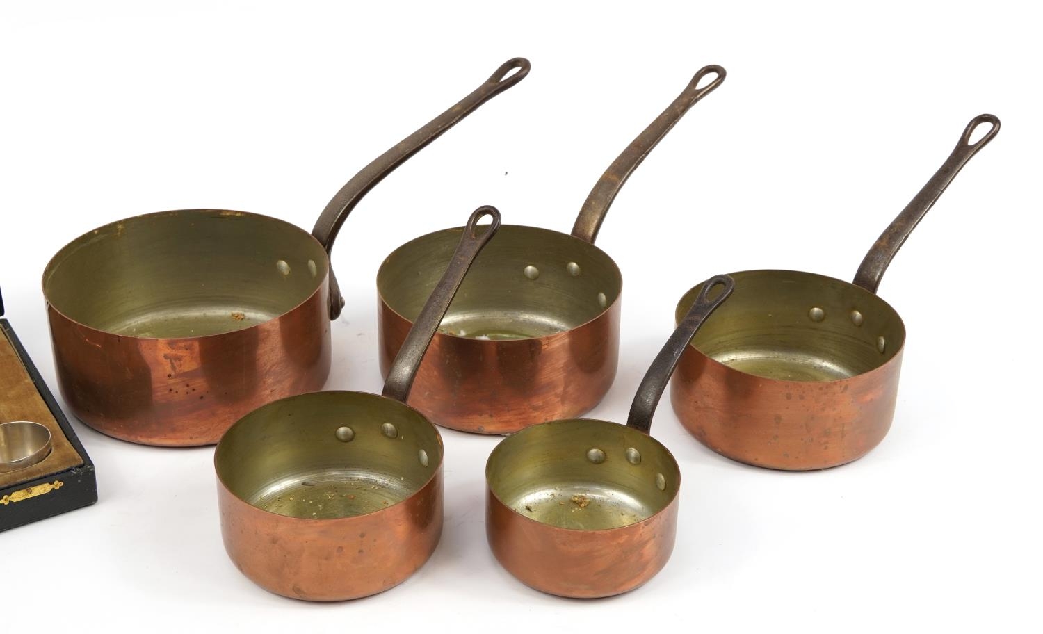Graduated set of five 19th century copper and iron saucepans and a set of six silver plated preserve - Image 3 of 3