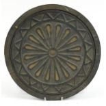 Cast iron coal hole, 39cm in diameter