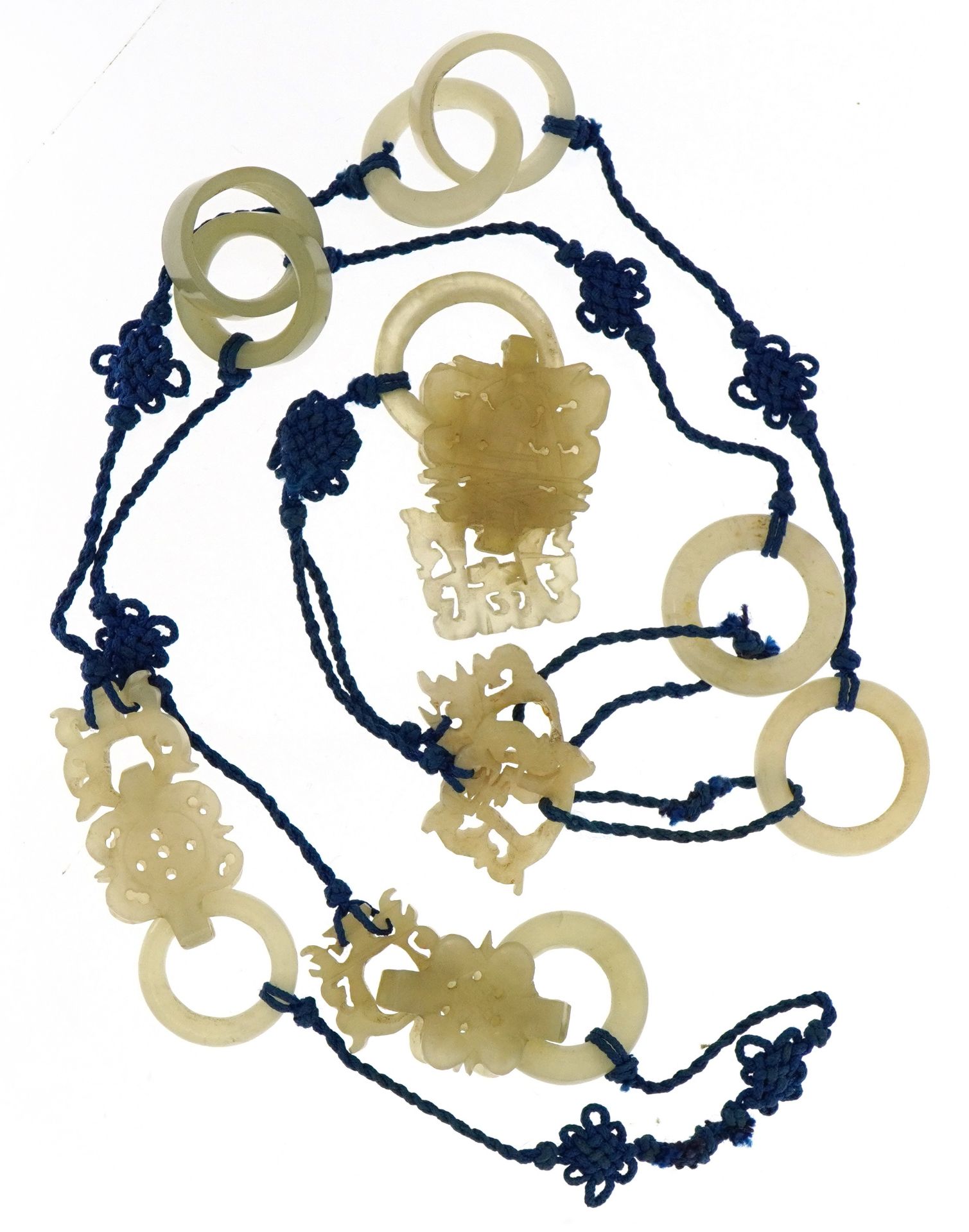 Chinese celadon jade carvings on blue cord necklace, with letter detailing it was brought by a