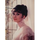 Bob Willoughby - Audrey Hepburn, signed photographic print in colour, mounted, framed and glazed,
