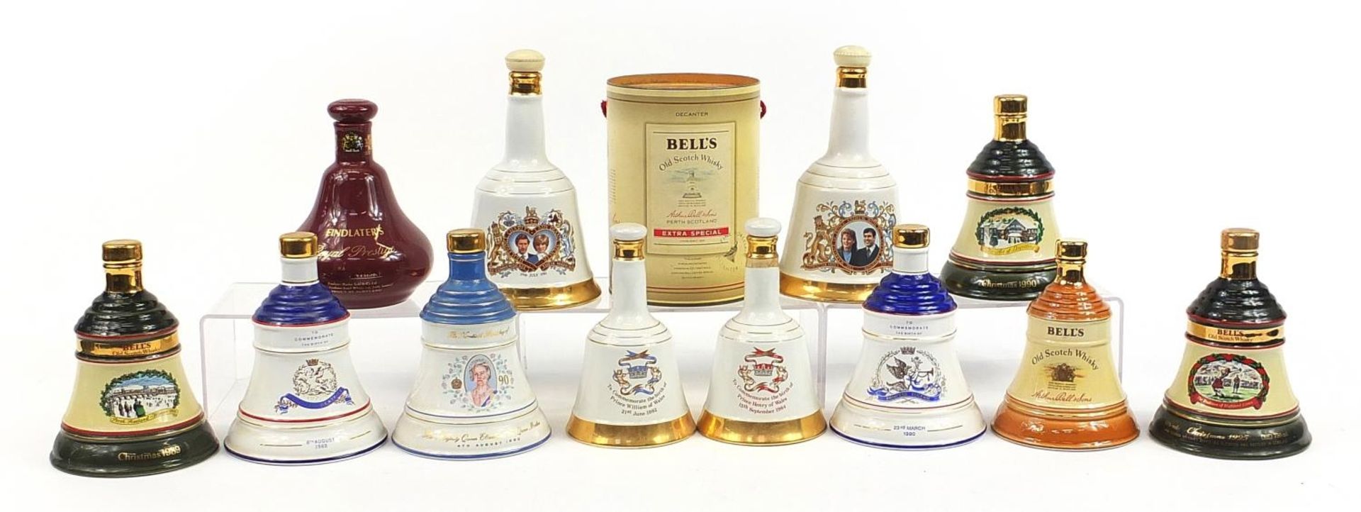 Twelve empty Bells whisky commemorative Wade decanters