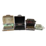 Three vintage typewriters and a Schubert Rastatt Exactus calculator comprising L C Smith & Bros,